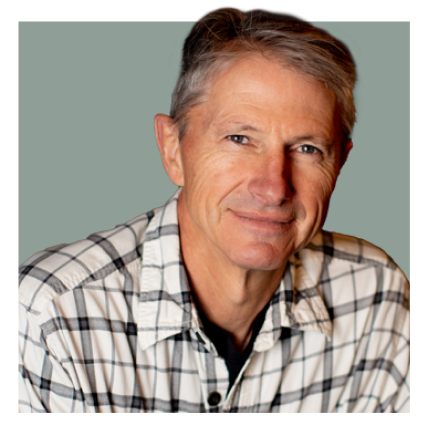 Headshot of Max Winders, author of The Adventures of Mooka & Lou. Max is smiling warmly, wearing a casual flannel button-up shirt. The image is clipped with no background.